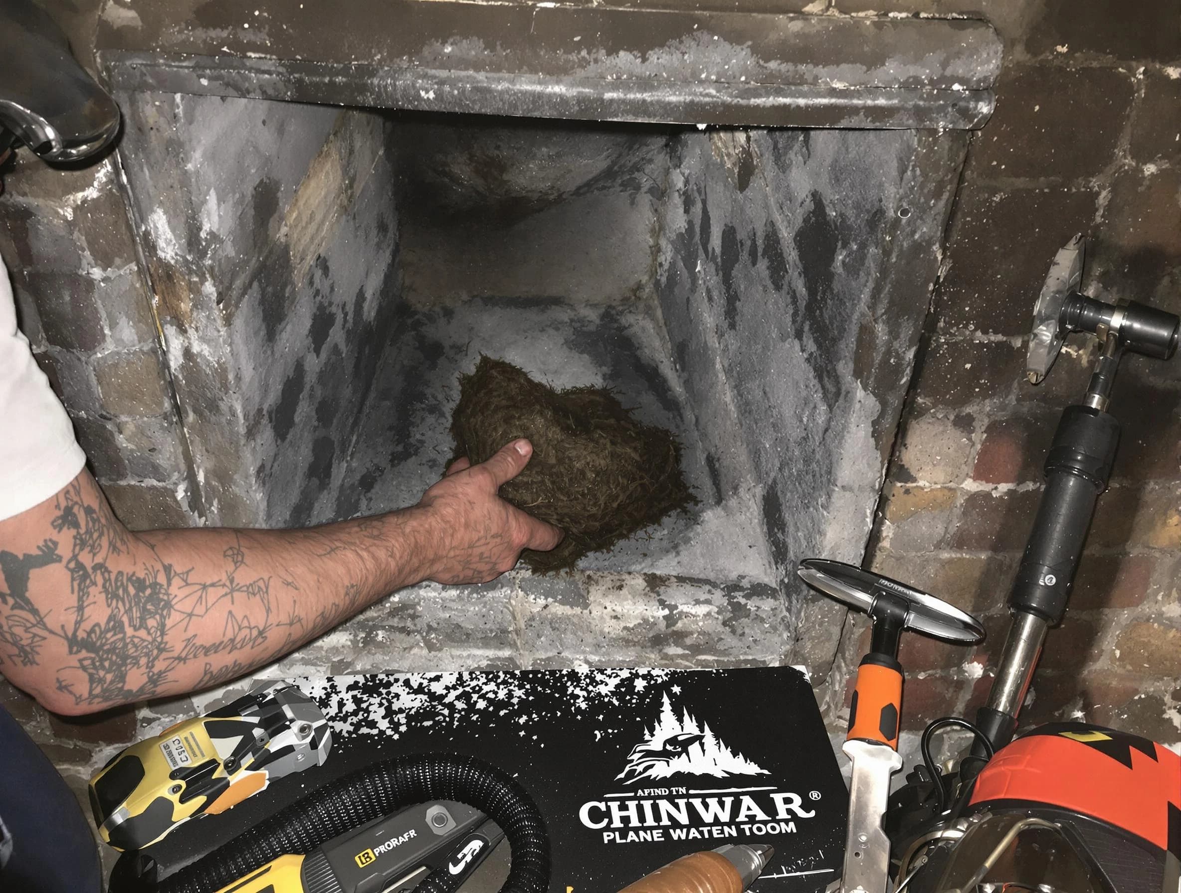 Union City Chimney Sweep safely removing debris and screening chimney in Union City, NJ